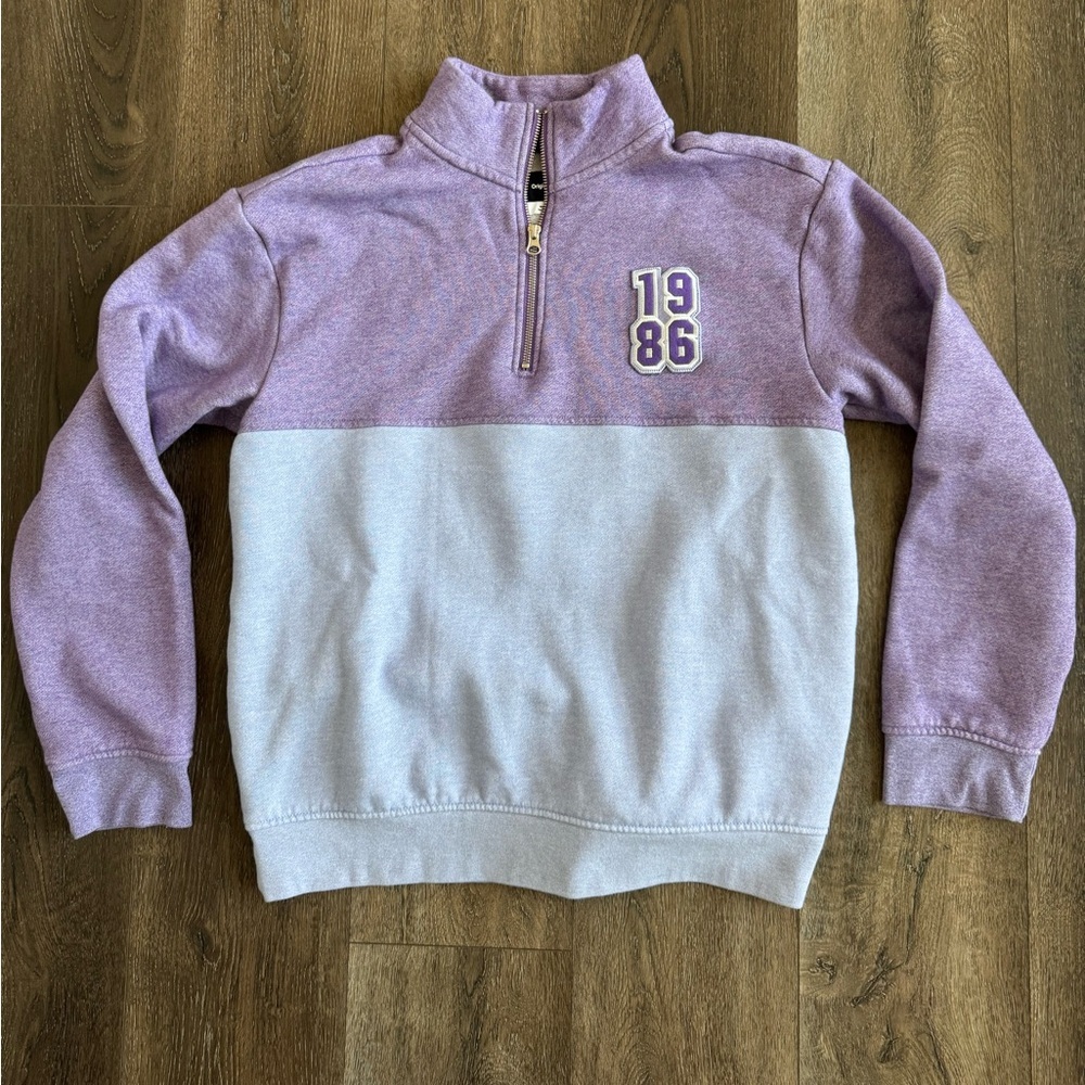 Purple and blue Quarter-Zip Sweatshirt, 1986 Original Use, women’s size medium.